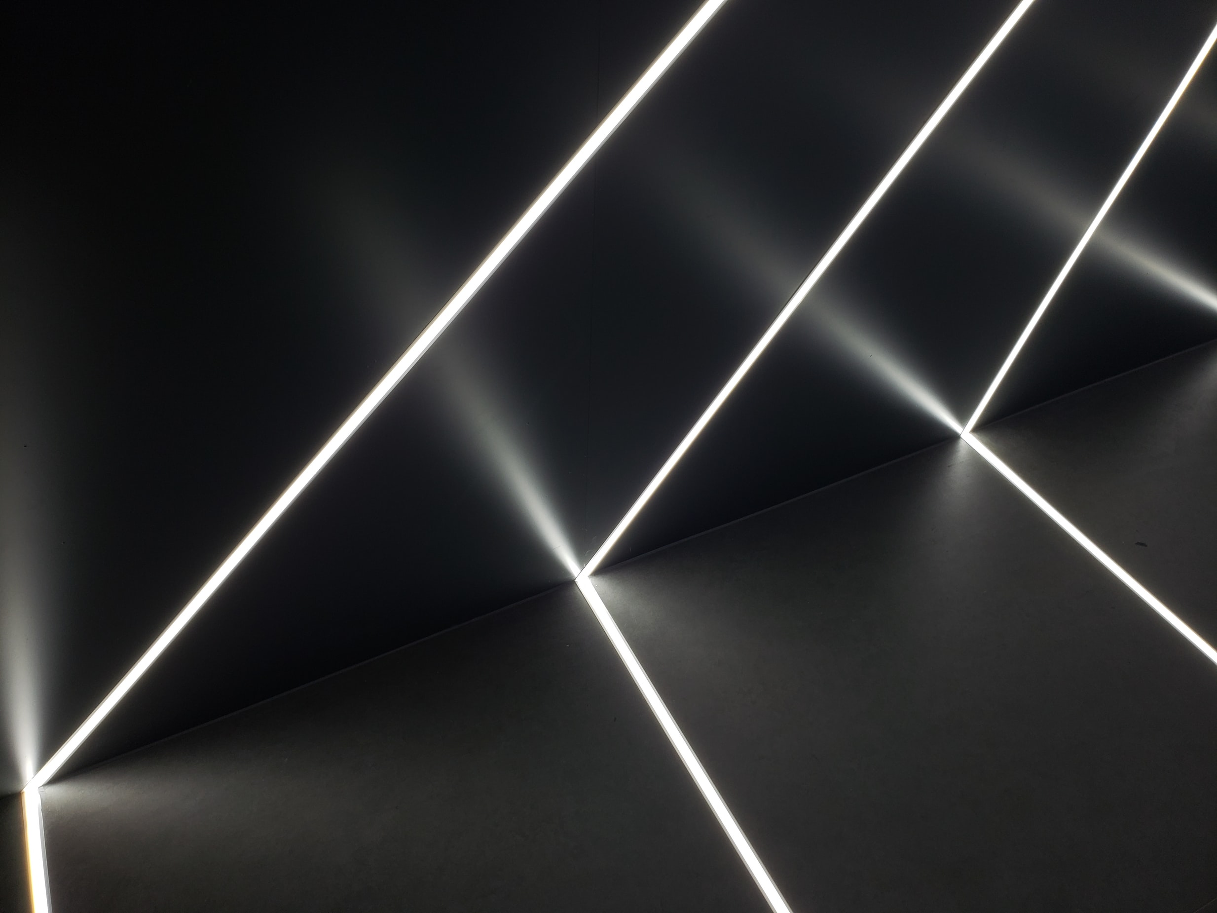 LED ribbons embedded in black wall